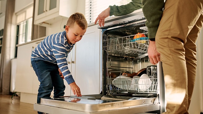 child_adding_cleaning_powder_to_dishwasher